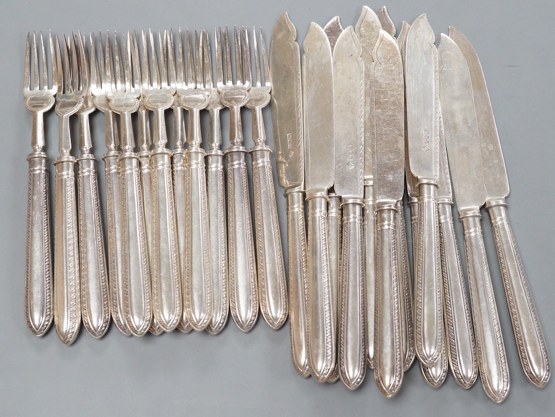 A set of twelve pairs of Edwardian silver fish eaters, Matin, Hall & Co, Sheffield, 1909, knife 21.2cm.